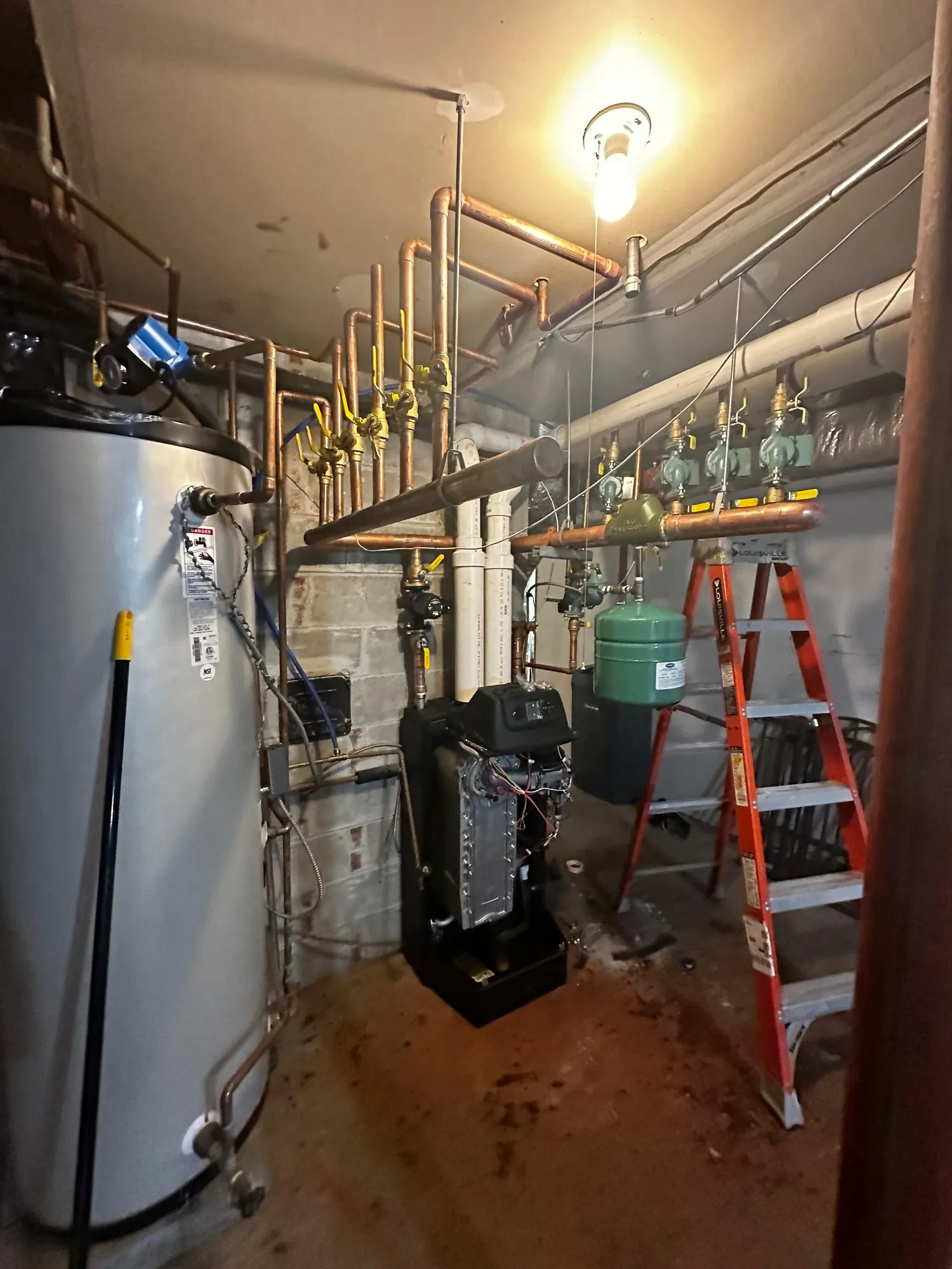 Boiler, tank water heater and expansion tank installed together in a basement