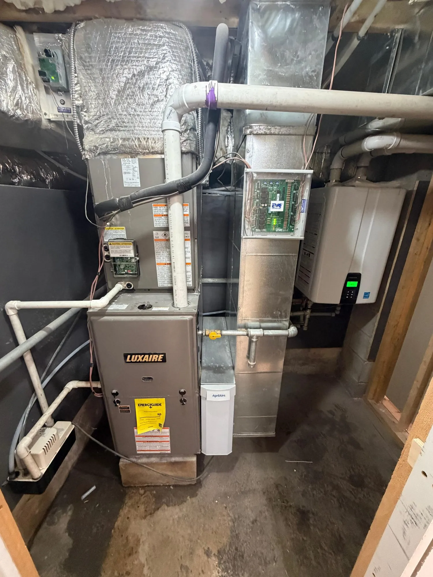 Luxaire furnace installed with a humidifier and supply duct trunk