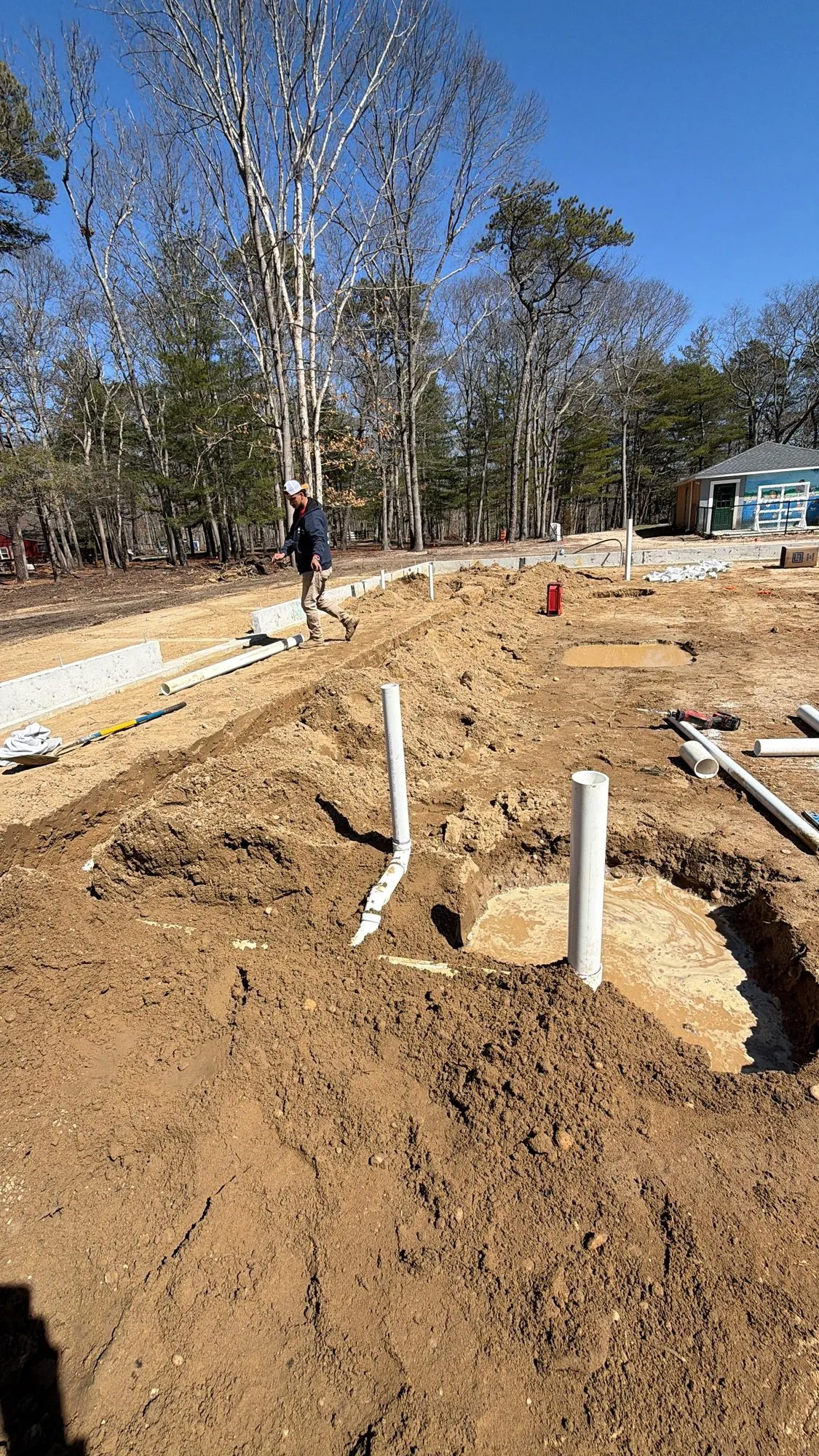 Underground sewer and water service lines being run on a new construction site