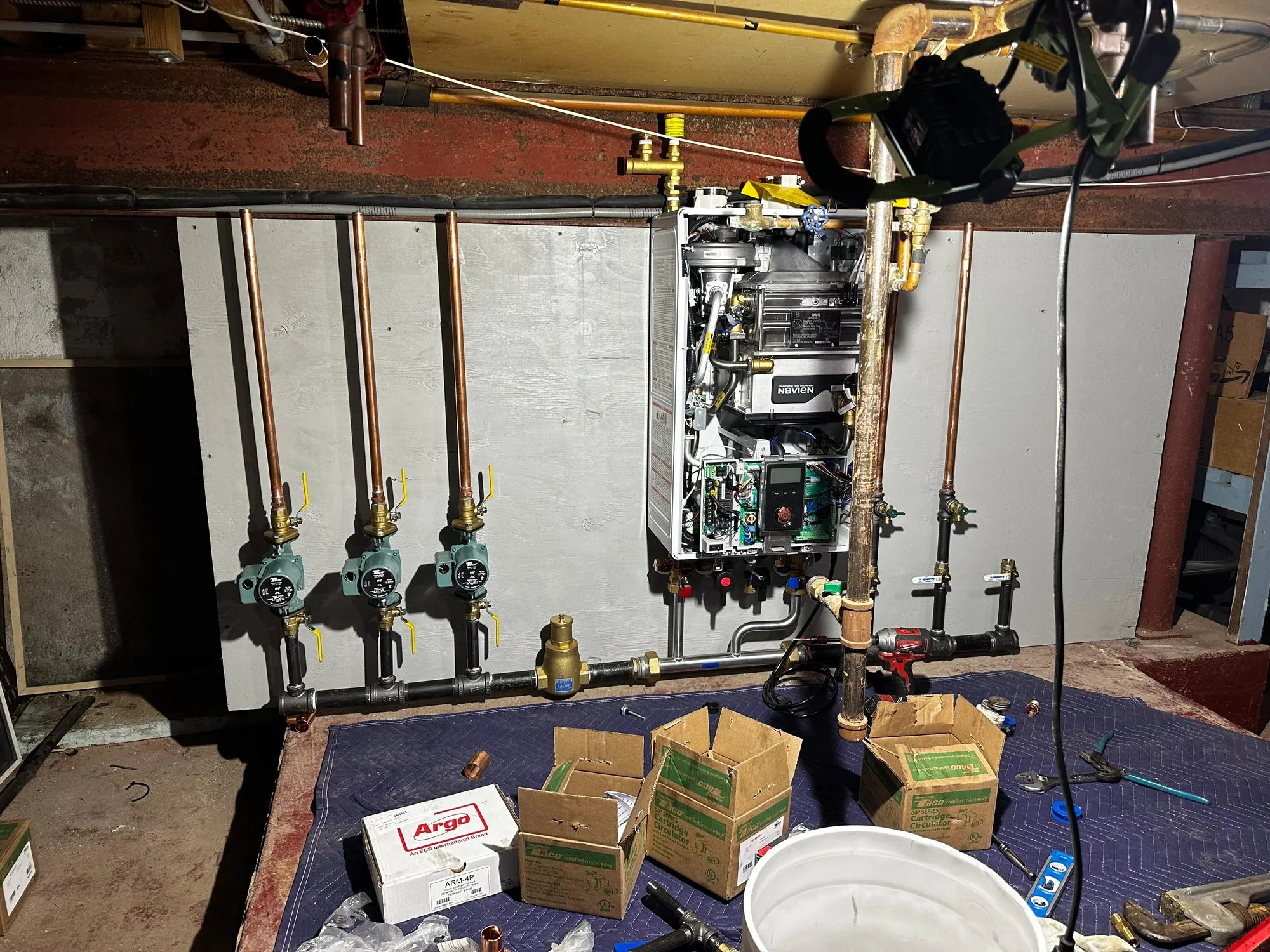 Wall-hung boiler installed with circulator pumps and Argo zone controls